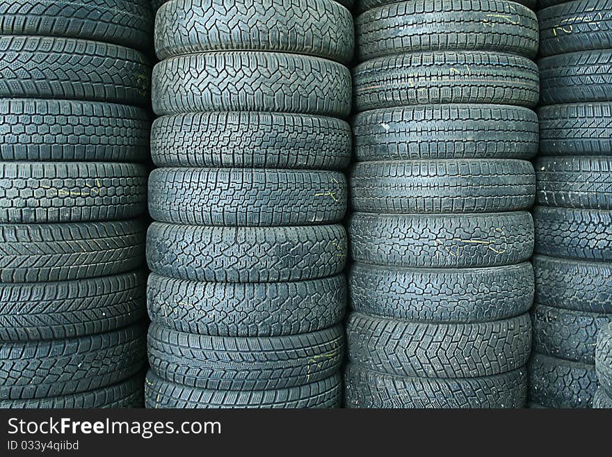 Stack of used tyres in a junkyard. Stack of used tyres in a junkyard