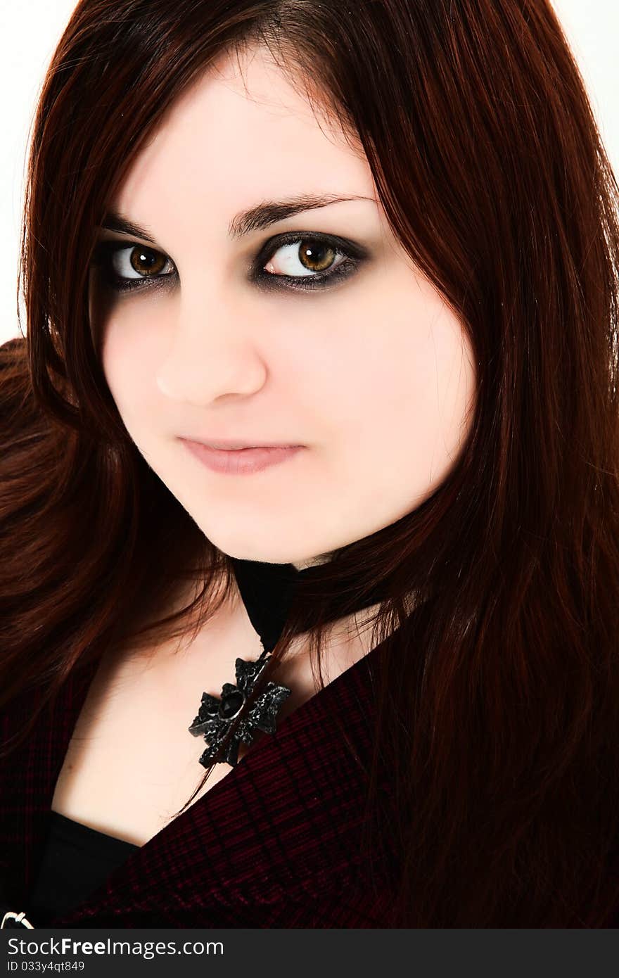 Beautiful 19 year old ginger girl close up with dark goth makeup, dark red hair, pale skin. Beautiful 19 year old ginger girl close up with dark goth makeup, dark red hair, pale skin.