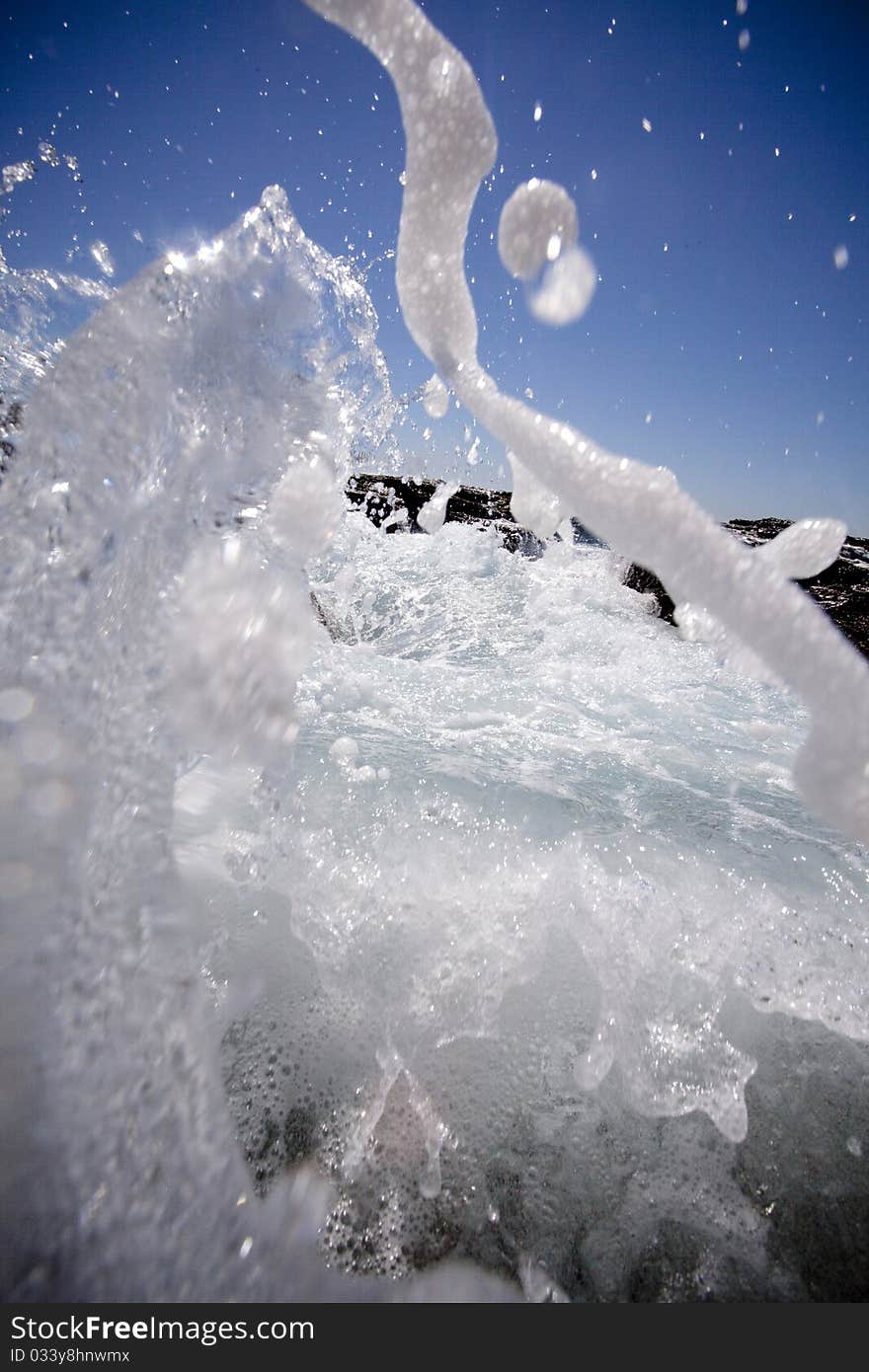 Waves moving forward and splashing on the Northern Beaches of Sydney, Australia.