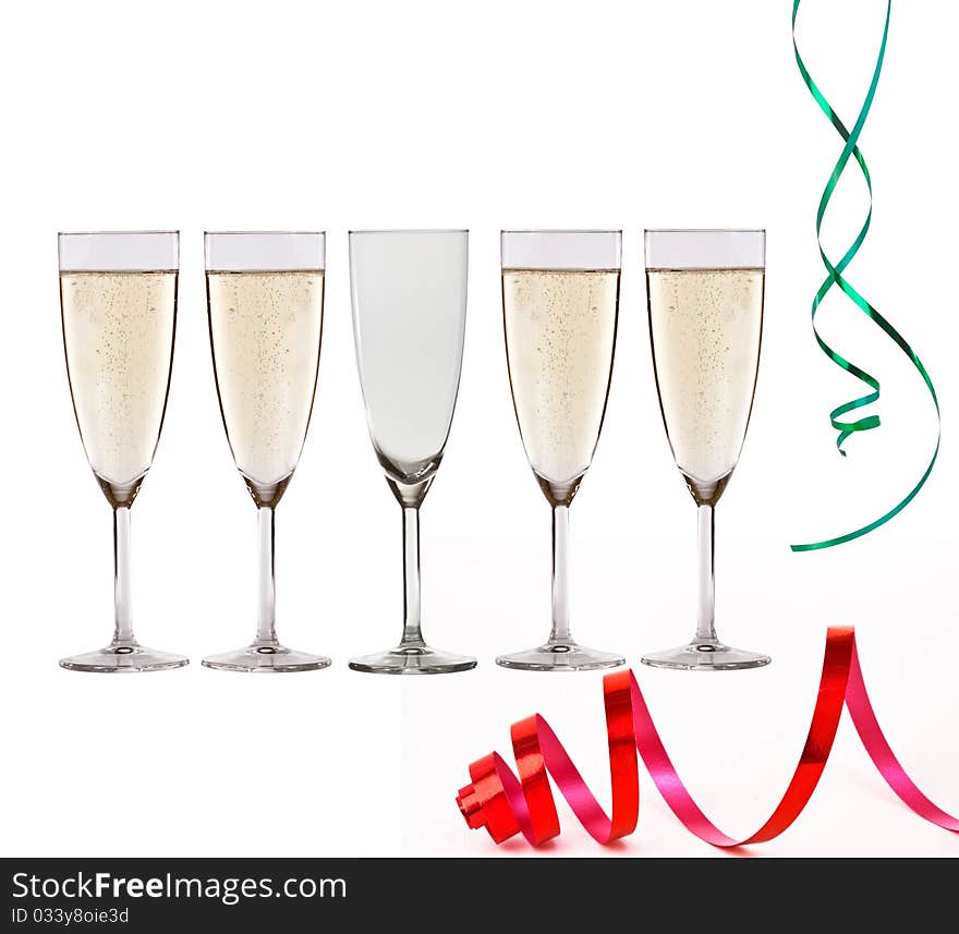 Glasses of champagne and christmas paper streamer