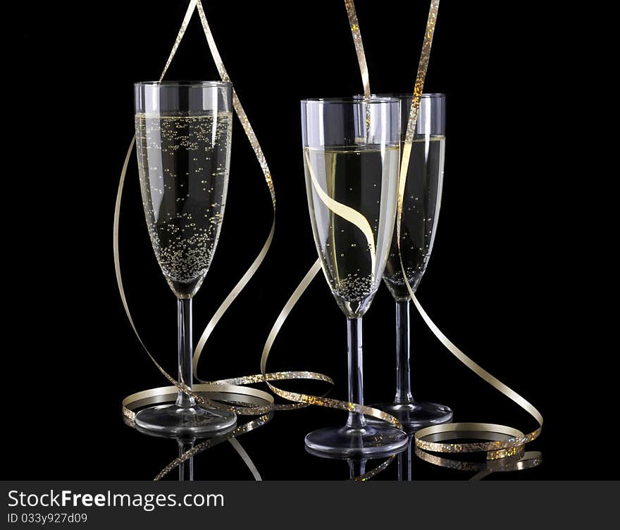 3 Glasses of champagne and paper streamer