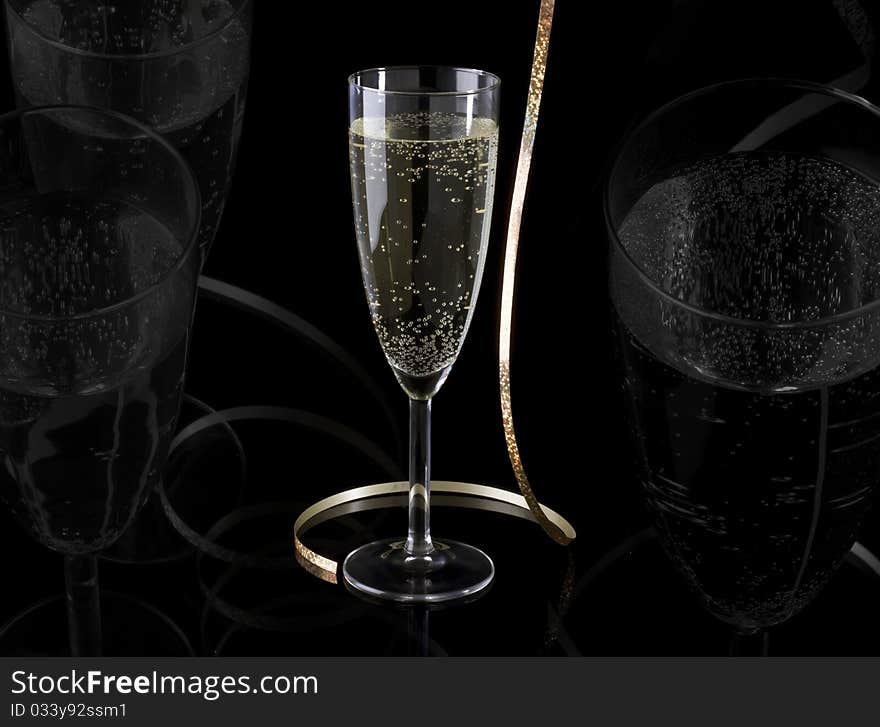 Glass of champagne and paper streamer