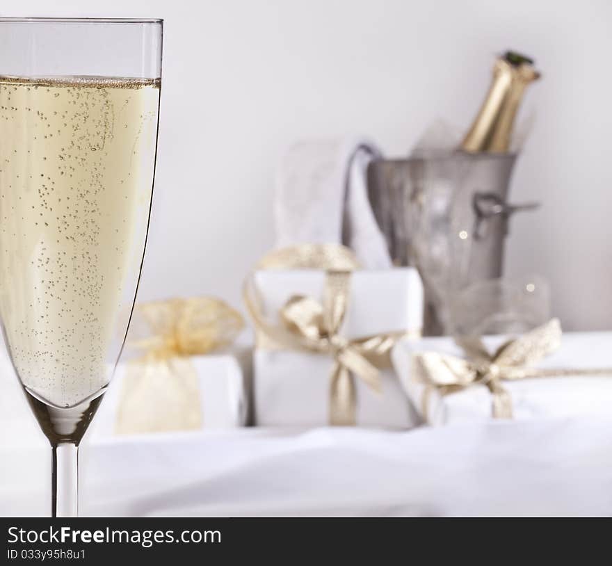 Glass Of Champagne And Gifts