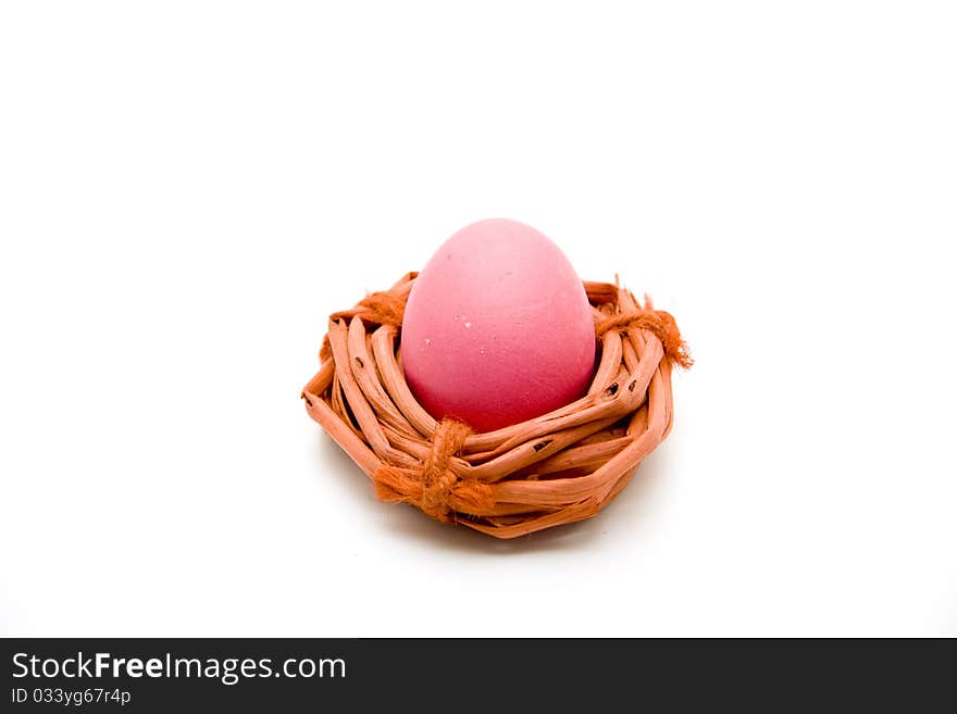 Red Easters egg with red wood wreath. Red Easters egg with red wood wreath