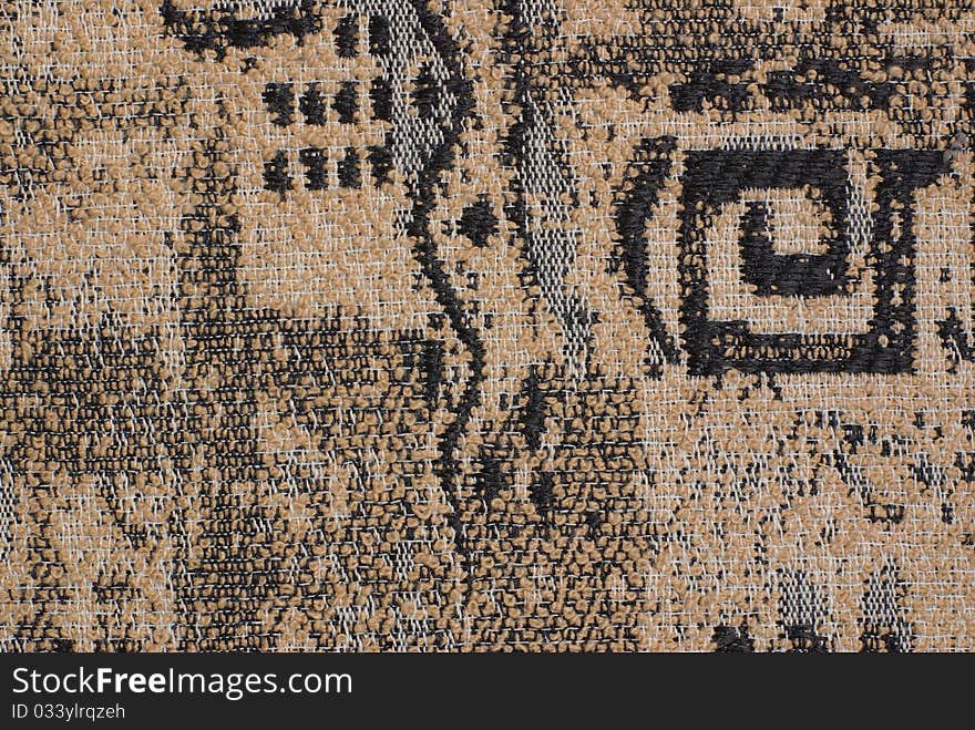 Brown fabric with an abstract black pattern