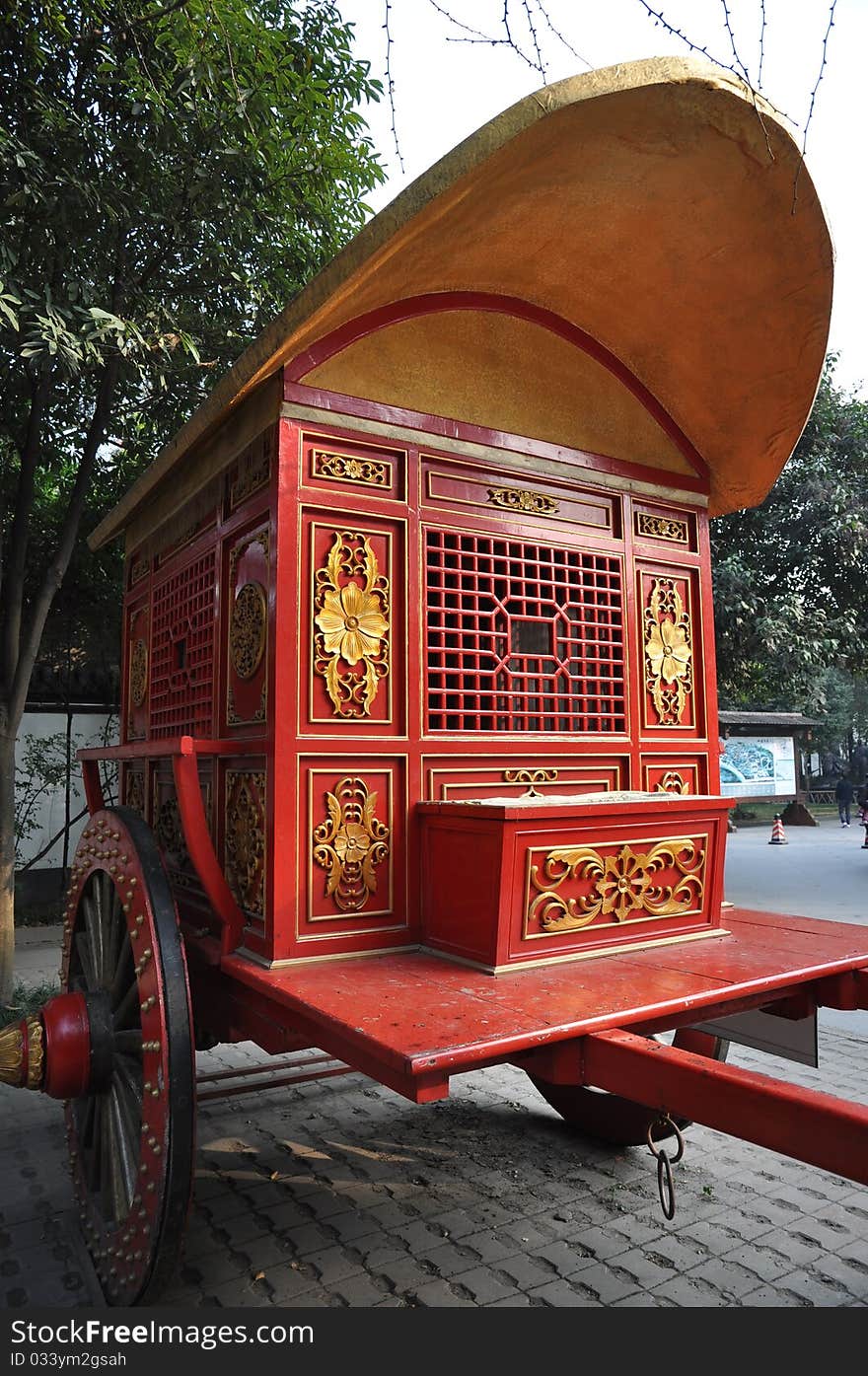 A chinese old carriage in an amusement park. A chinese old carriage in an amusement park.