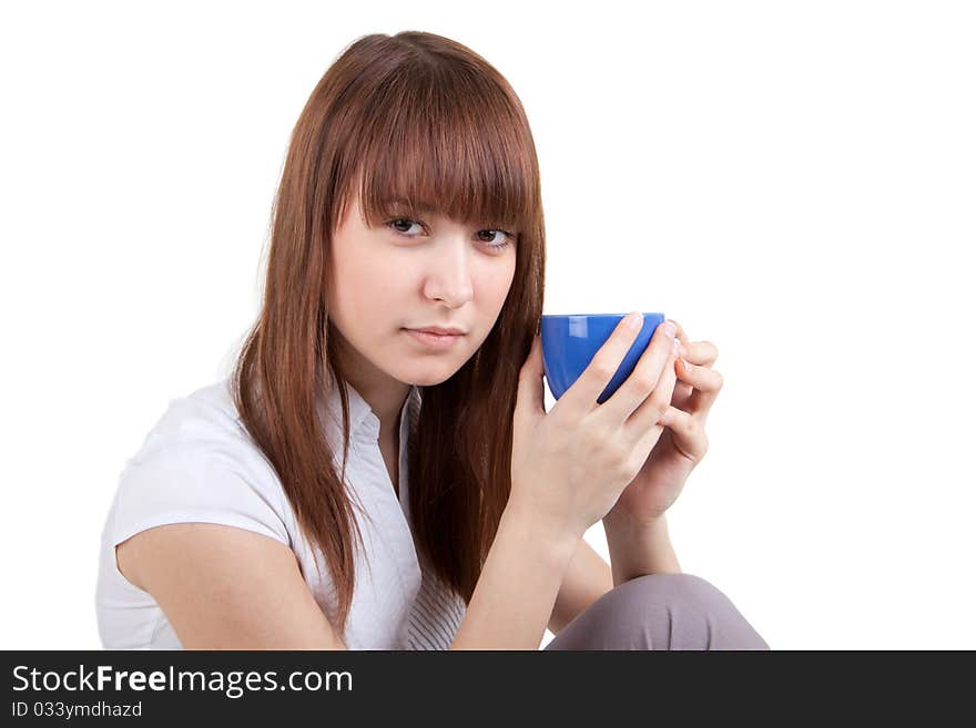 The beautiful girl with a dark blue cup. The beautiful girl with a dark blue cup