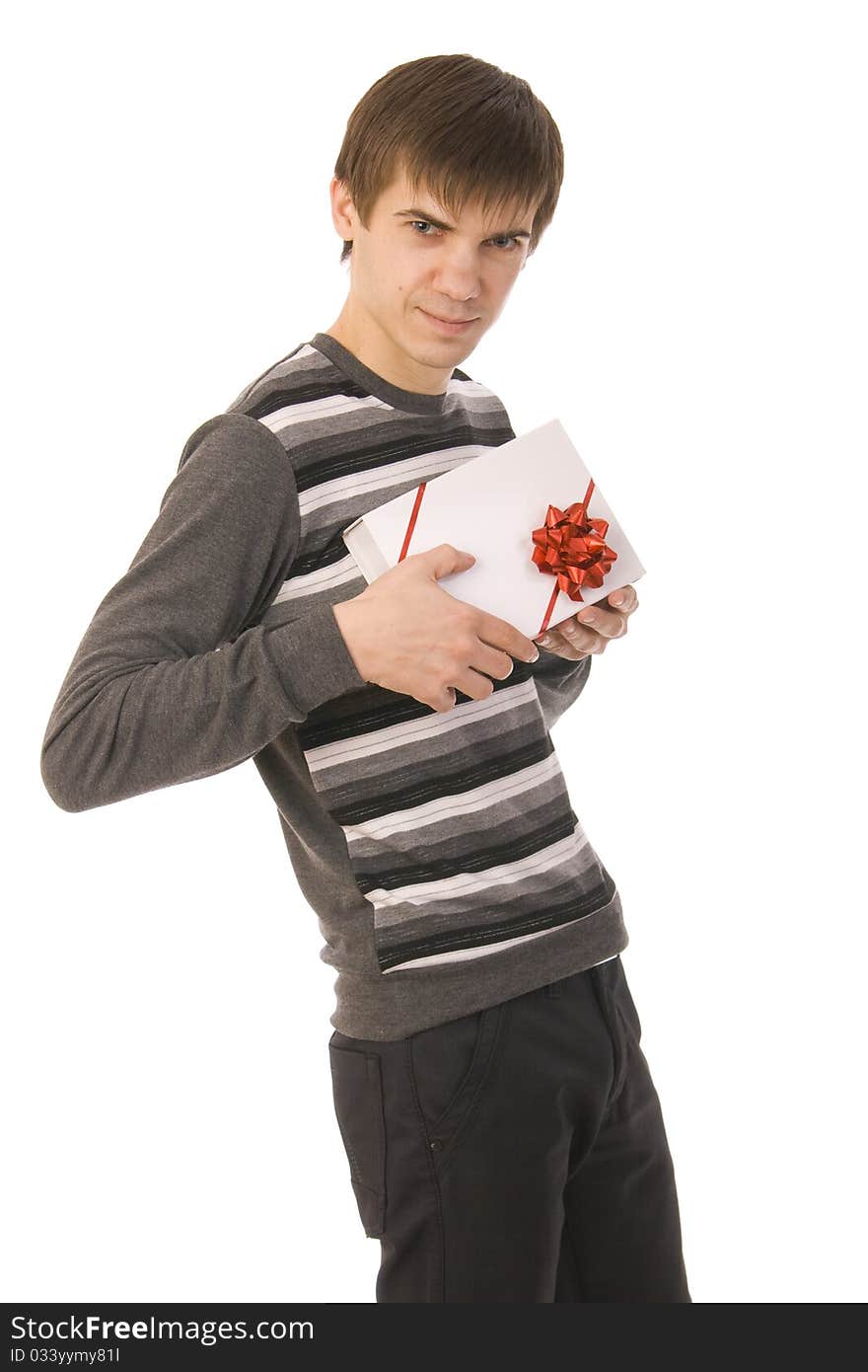 Handsome smiley man holding gift. isolated on white background