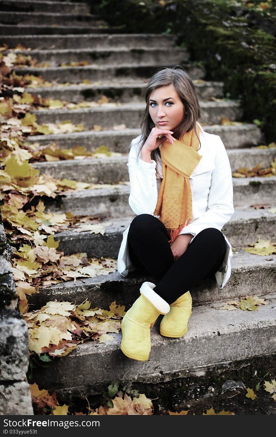 Beauty sitting in autumn park. Beauty sitting in autumn park