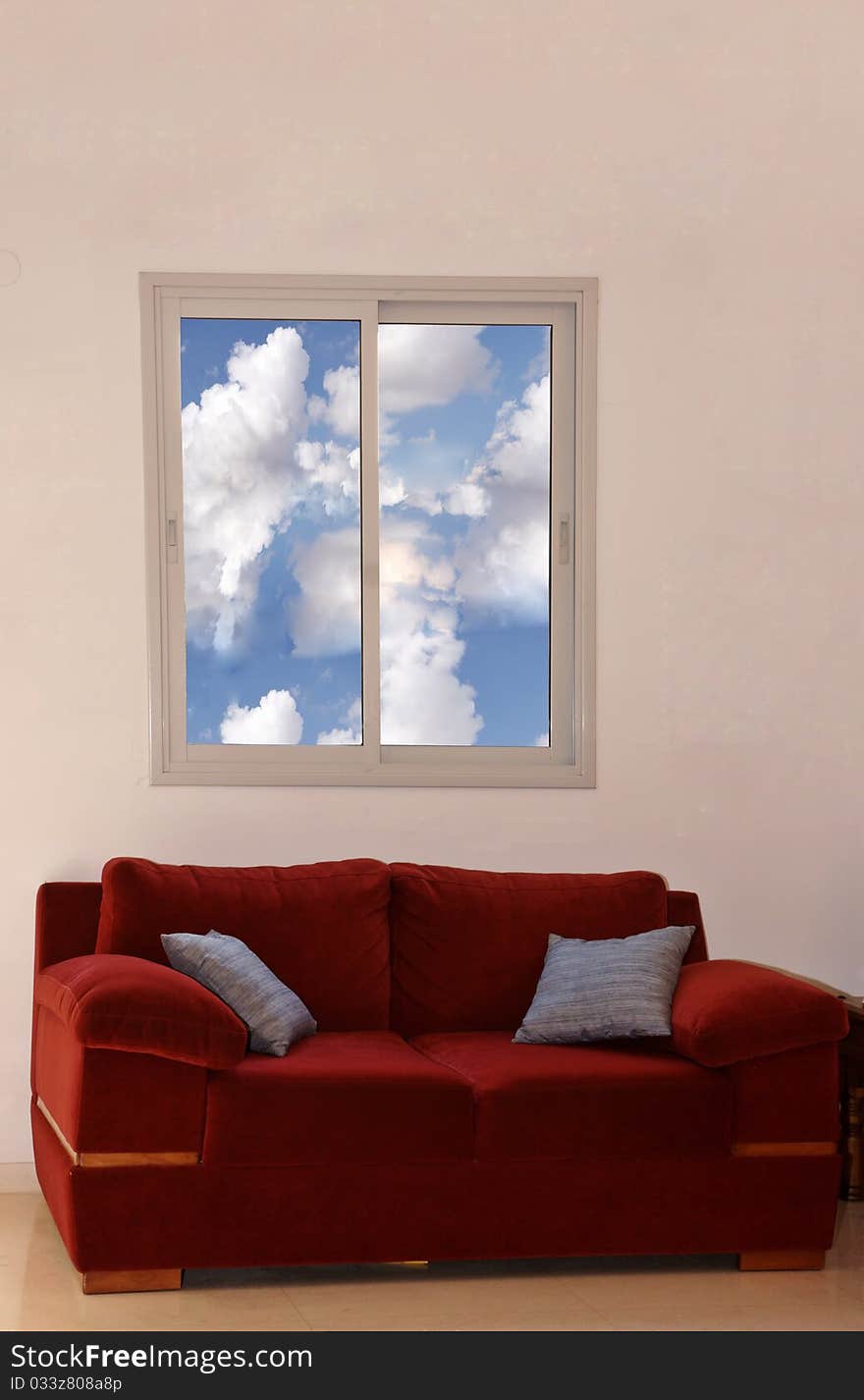 View of a modern living room with red sofas