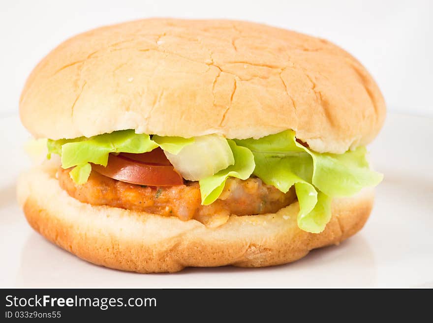 Hamburger in plate on white background