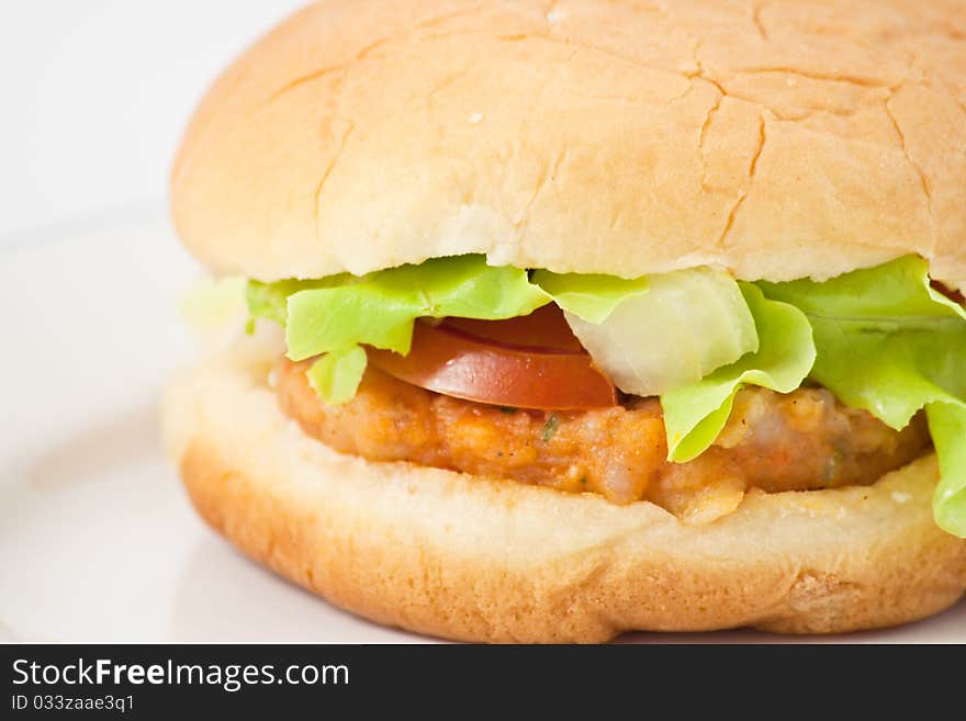 Hamburger in plate on white background