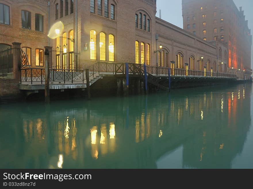 It is a beautiful and ancient architecture along a river in the evevning in Venice, Italy. It is a beautiful and ancient architecture along a river in the evevning in Venice, Italy.