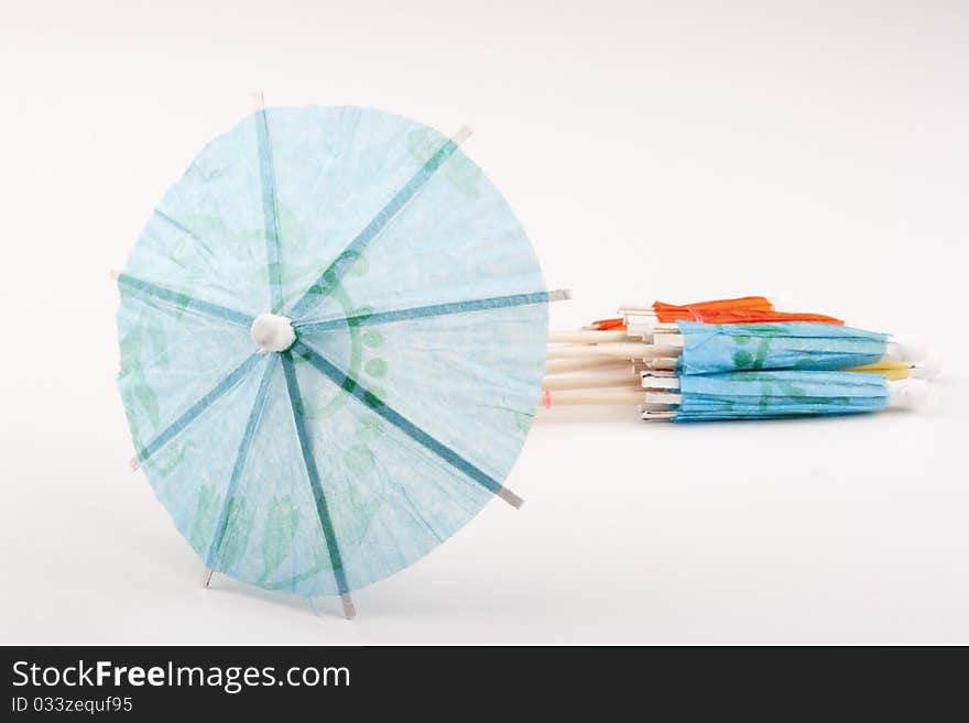 Paper umbrella to decorate the glasses with a cocktail.