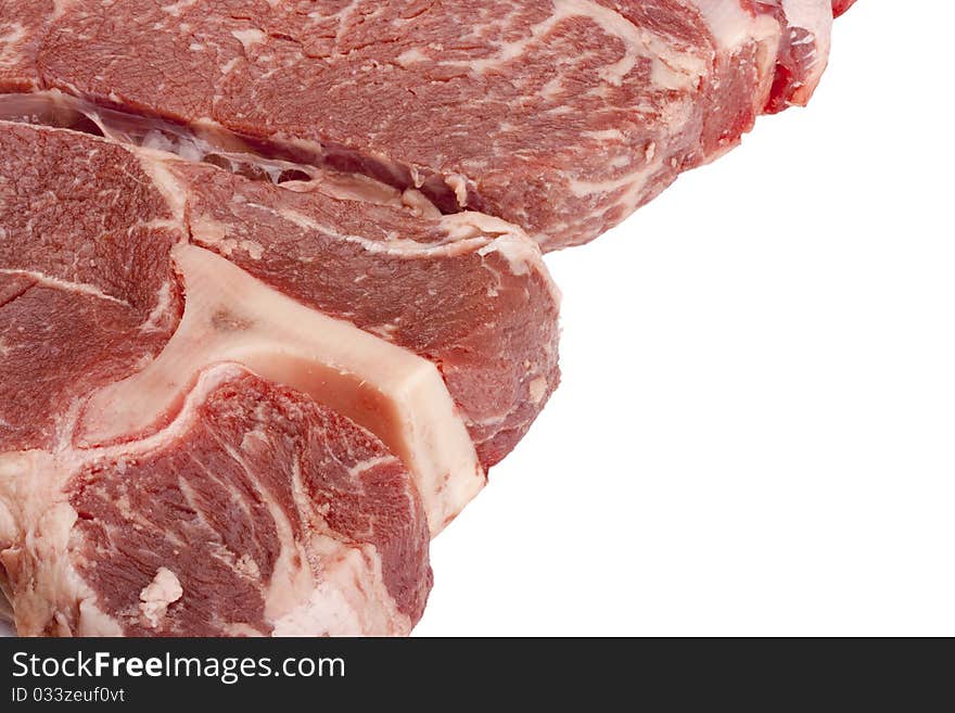 A large piece of raw meat on a white background.