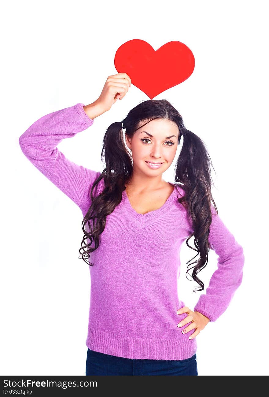 Beautiful brunette girl with a Valentine card in her hands. Beautiful brunette girl with a Valentine card in her hands