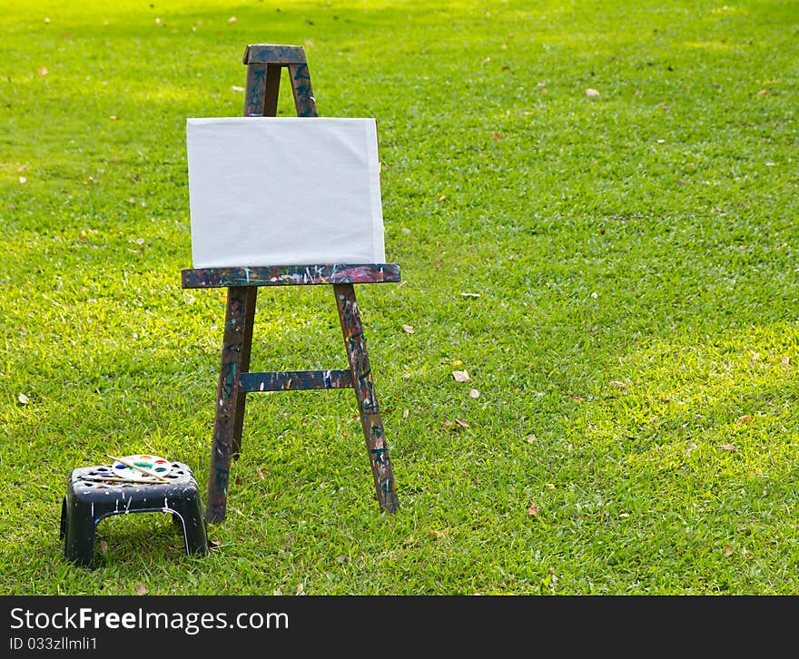 The painting board on fresh green grass. The painting board on fresh green grass