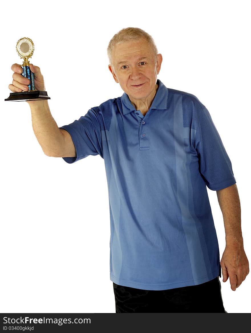 A senior man in happily displaying a small generic trophy.  Isolated on white. A senior man in happily displaying a small generic trophy.  Isolated on white.