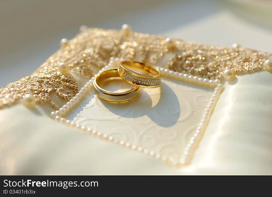 Two Golden Wedding Rings With Diamonds