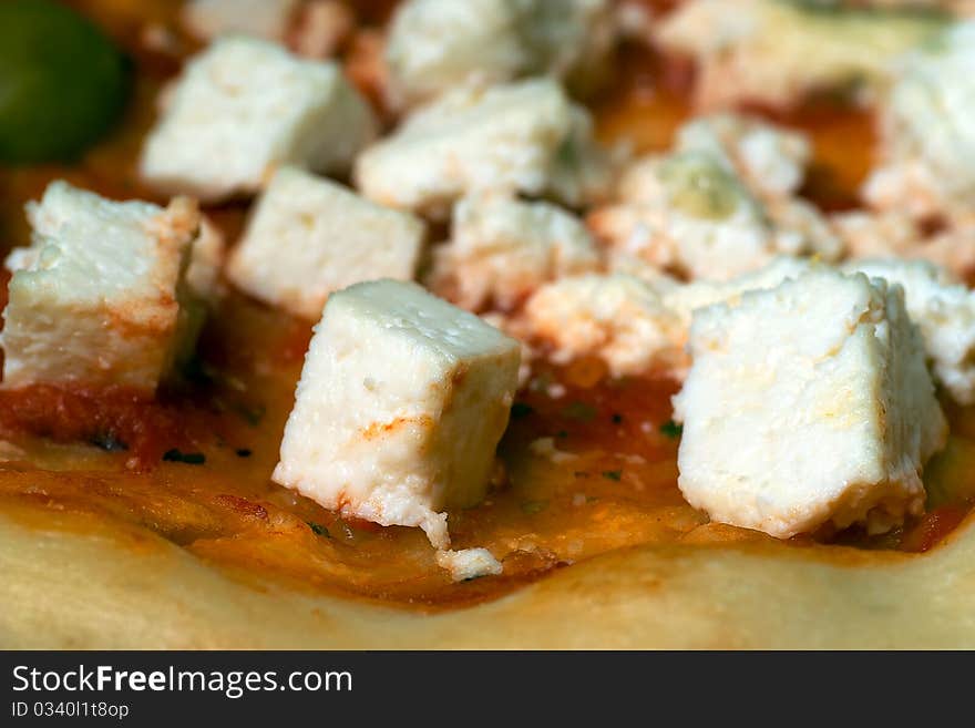 Cheese pizza with olives close