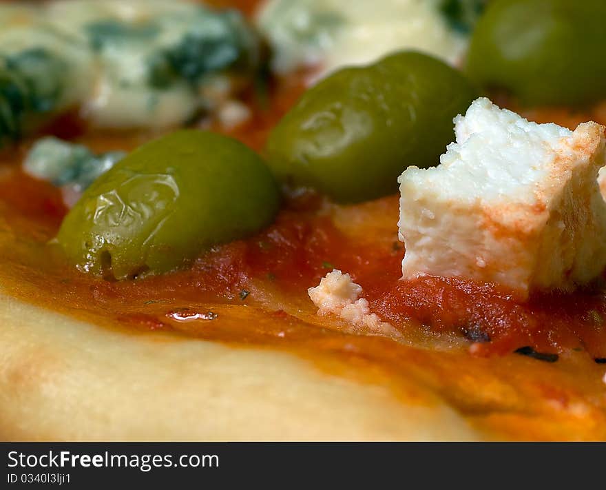 Cheese pizza with olives close