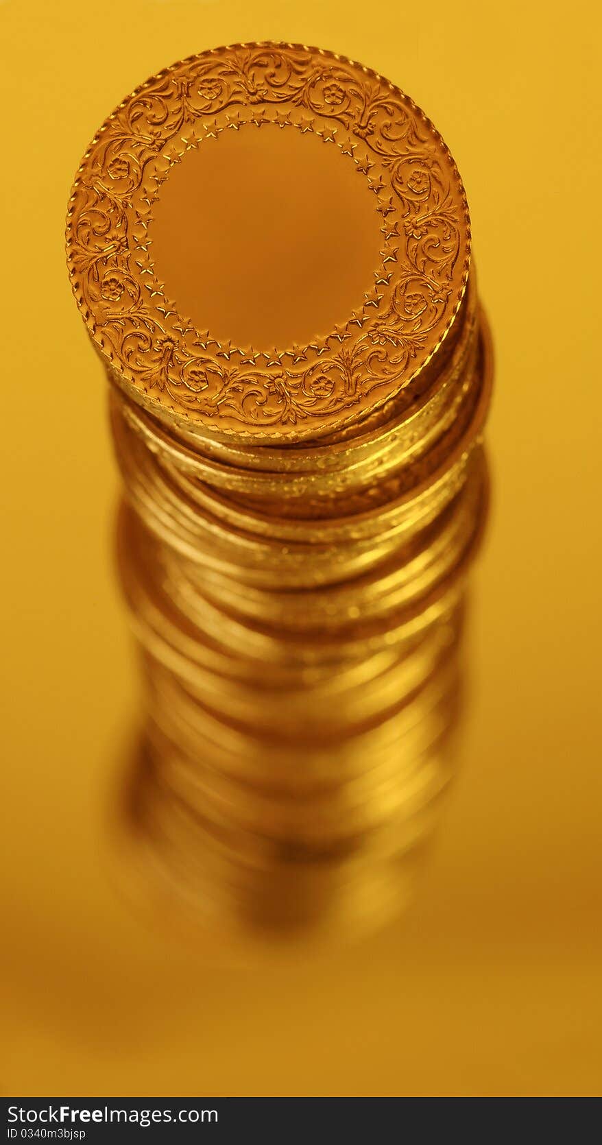 Gold coins with color and blur effect.