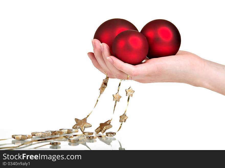 Christmas decoration in woman's hand, isolated