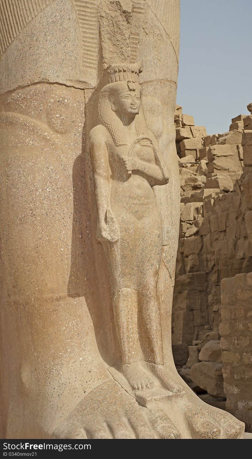 Statue in the temple of Ramses III at Karnak in Luxor. Statue in the temple of Ramses III at Karnak in Luxor