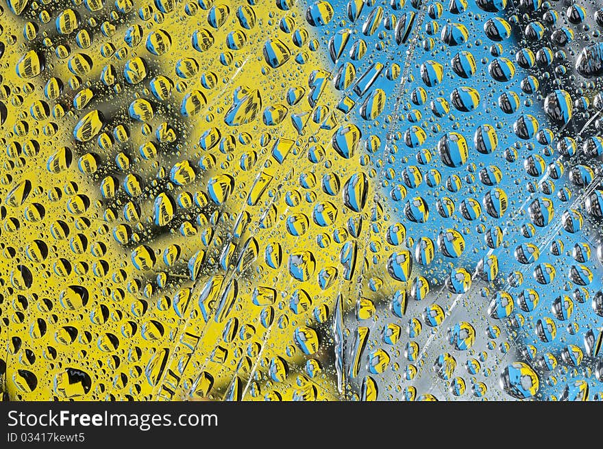 Background with color water drop. Rain drop on the glass