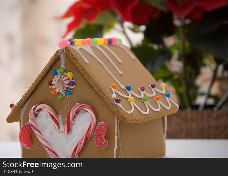 A gingerbread house all decorated with icing and candy.