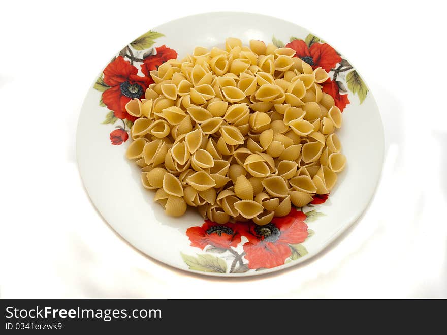 Dry vermicelli in a plate on a white background. Dry vermicelli in a plate on a white background.