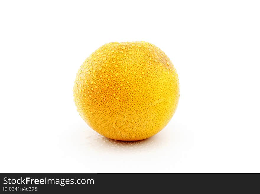 Grapefruit with drops on a white background