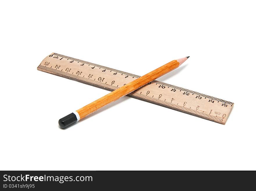 Ruler and pencil on a white background