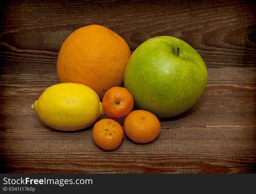 Fresh fruit on wood background