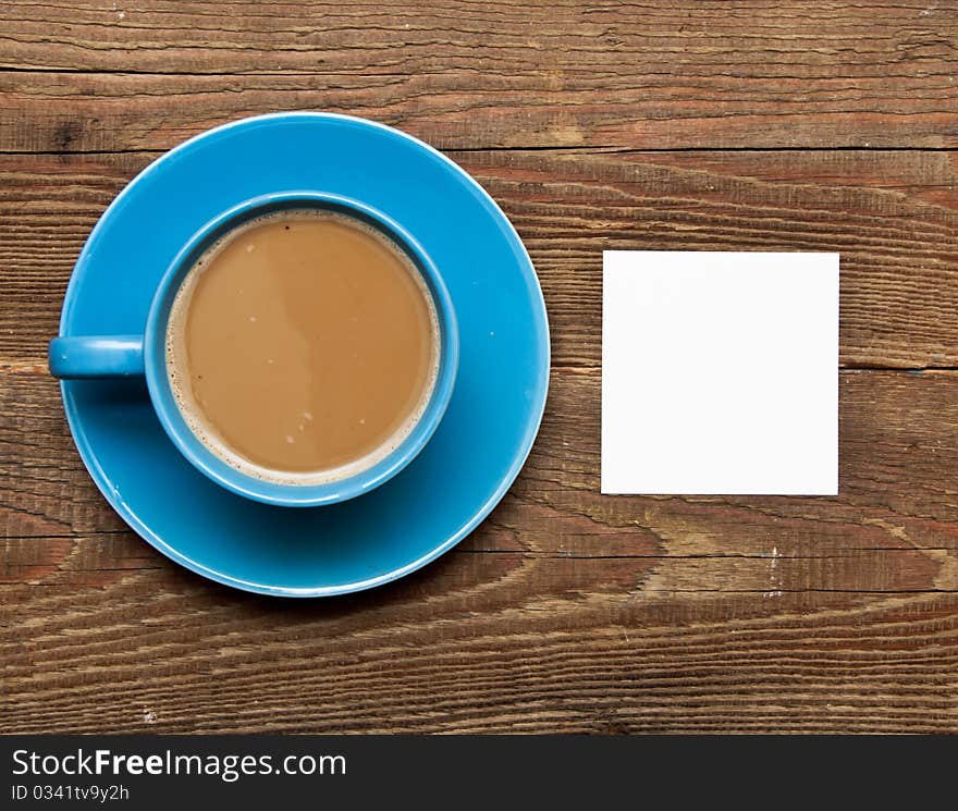 Blank card on coffee cup