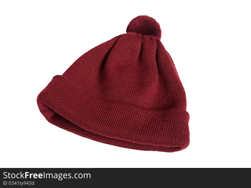 Woolen knitted cap in red on a white background. Woolen knitted cap in red on a white background