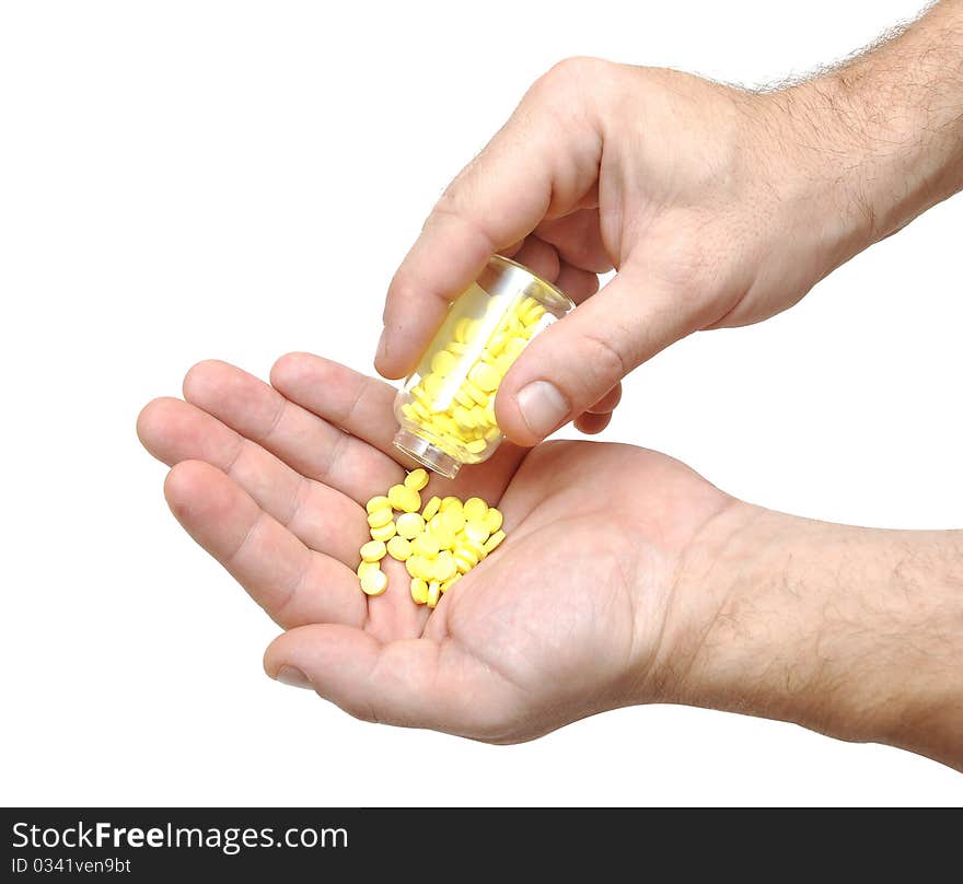 Closeup on man's hands with pills and pill container.