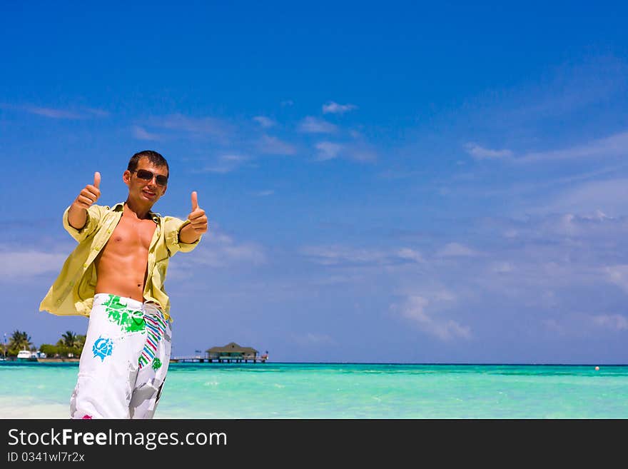 Young man on a tropical beach