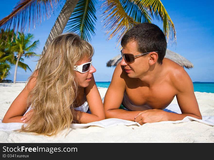 In love young couple on a tropical beach