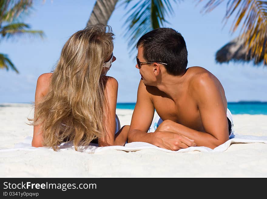 In love young couple on a tropical beach