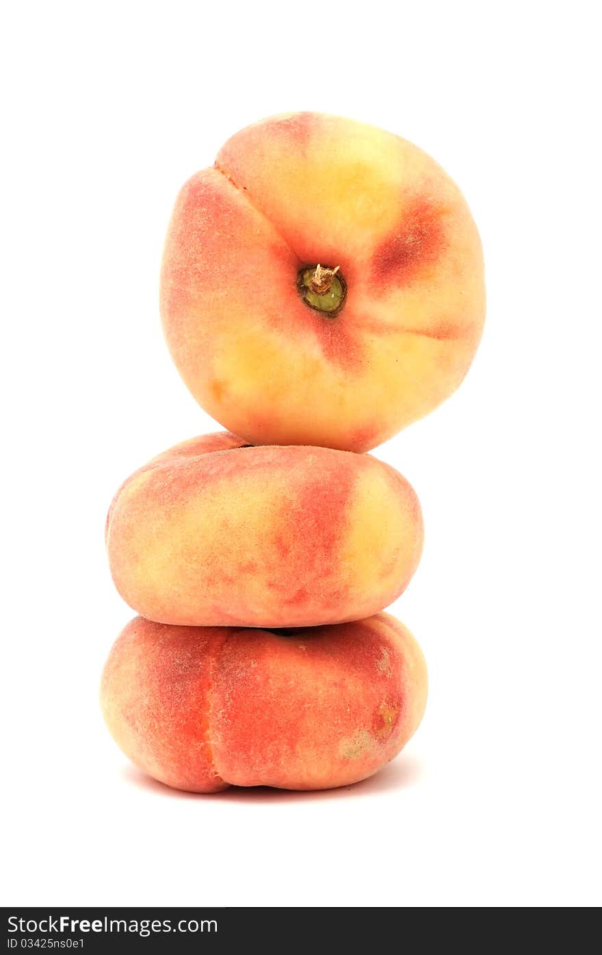 Flat peaches isolated on a white background