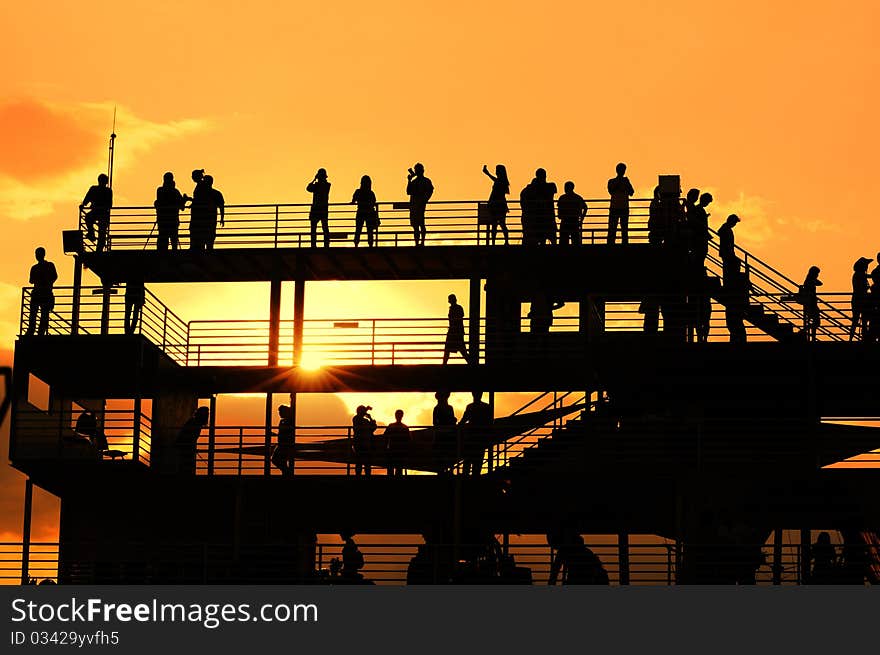 Sunset silhouette of peoples at view point. Sunset silhouette of peoples at view point.