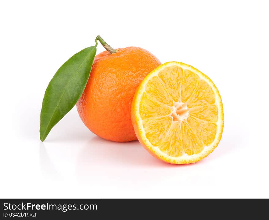 Fresh mandarin fruits with cut and green leaves