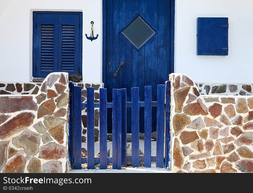 Exterior of a traditional house in Santorini Island, with the blue and white as the major colors. Exterior of a traditional house in Santorini Island, with the blue and white as the major colors