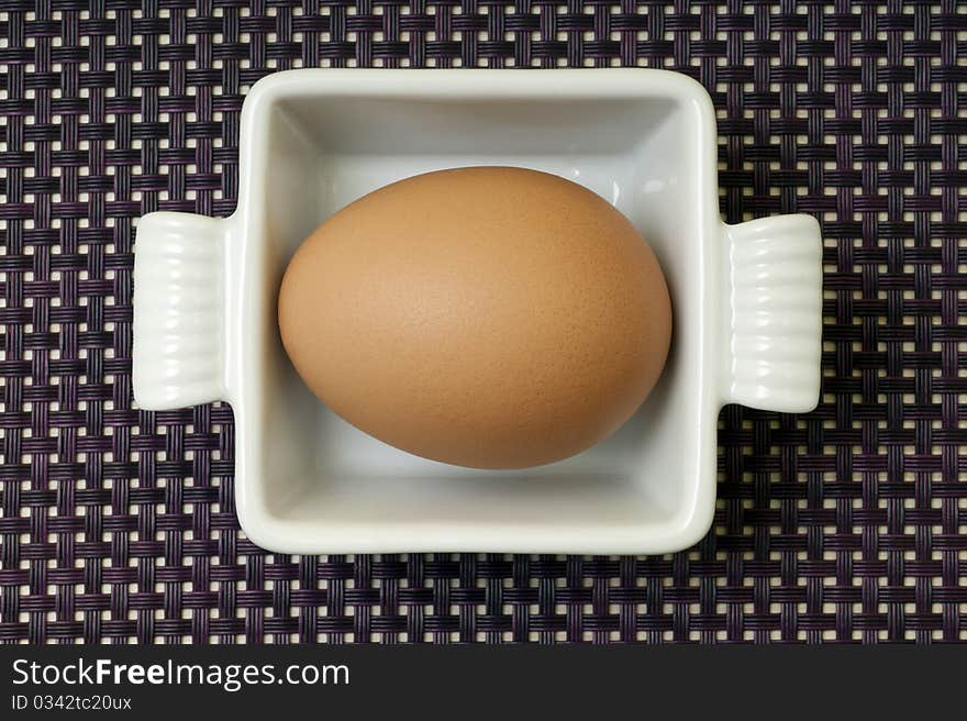 Egg in a ceramic pan. Egg in a ceramic pan