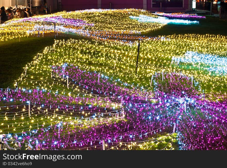 Decoration of small lamps on grass floor