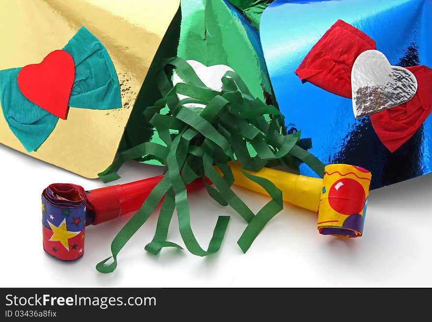 Party hats and party blowers on a plain white background.