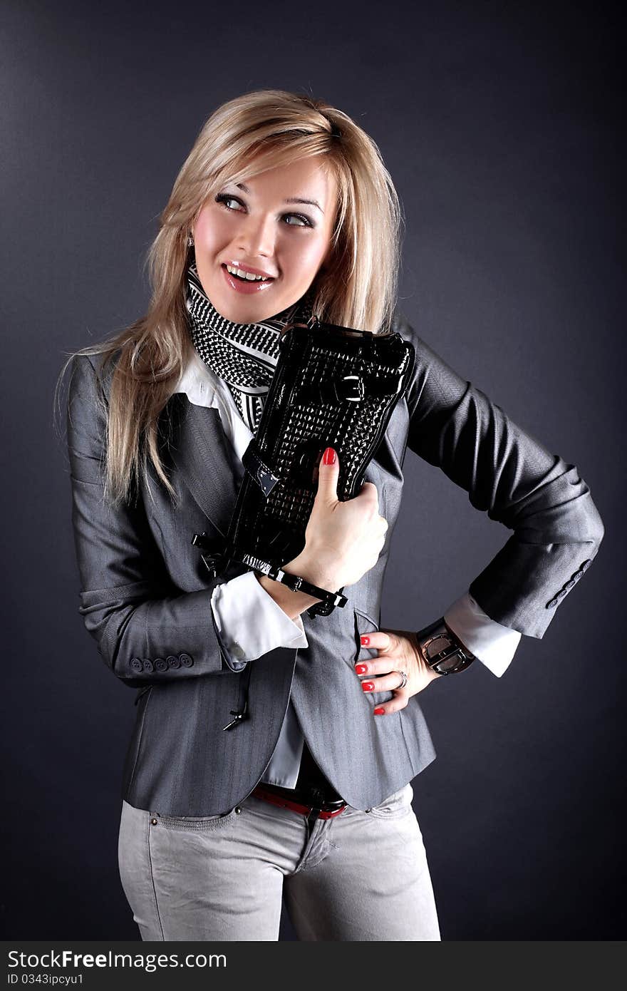 Fashion young woman with clutch bag