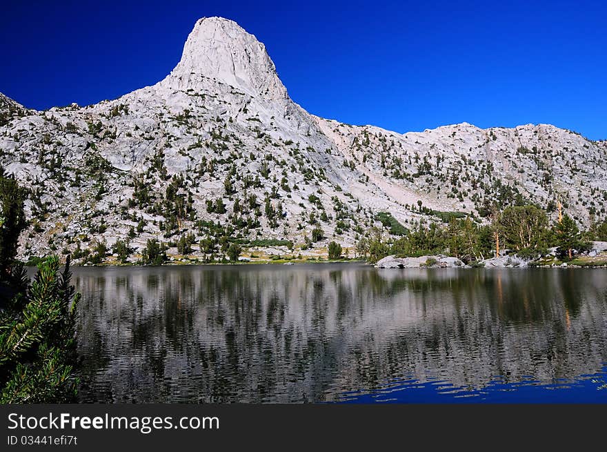 A picture of Fin Dome with its reflection across the lake underneath. A picture of Fin Dome with its reflection across the lake underneath