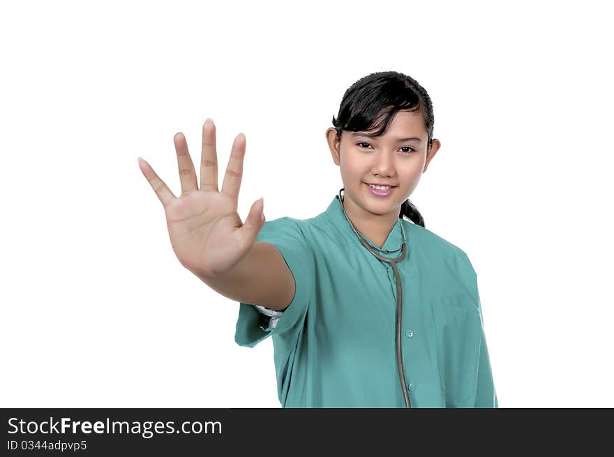 A Doctor wearing scrub say stop isolated over white background. A Doctor wearing scrub say stop isolated over white background